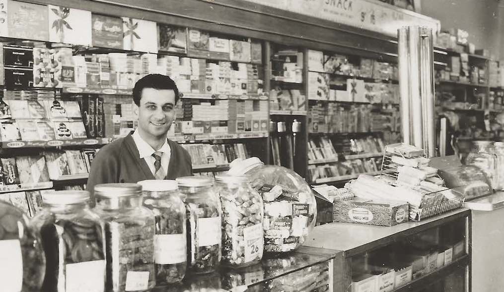 Emanuel Comino behind the counter of his milk bar in Guildford, Sydney, 1960s