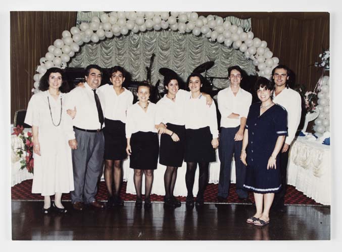 The Adasal family with staff at their Bosphorus Function Centre in Auburn, 1990s. Şükran, Halit and Hale are at far left, with Funda in the centre. Reproduced courtesy Hale Adasal.
