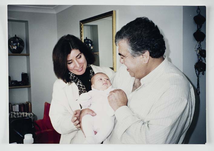 Şükran and Halit Adasal with their newborn granddaughter Yasemin, 2000. Reproduced courtesy Hale Adasal.