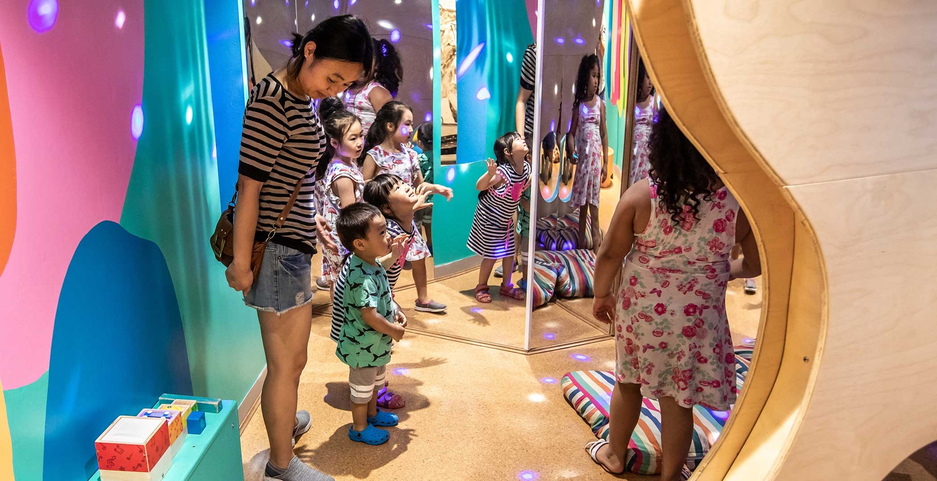 A group of young children playing the museums Under 5 play space