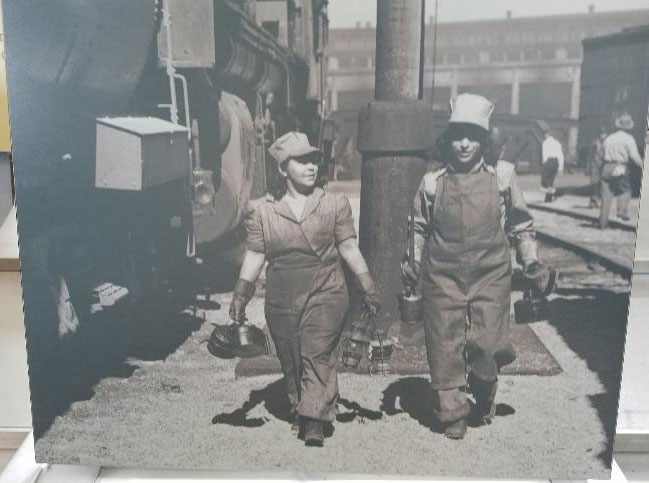 Rosies in the train yard. Photo credit: Olivia Smalley, taken at Rosie the Riveter World War II Homefront National Historic Park, depicting Mexican-American women in San Bernardino, CA
