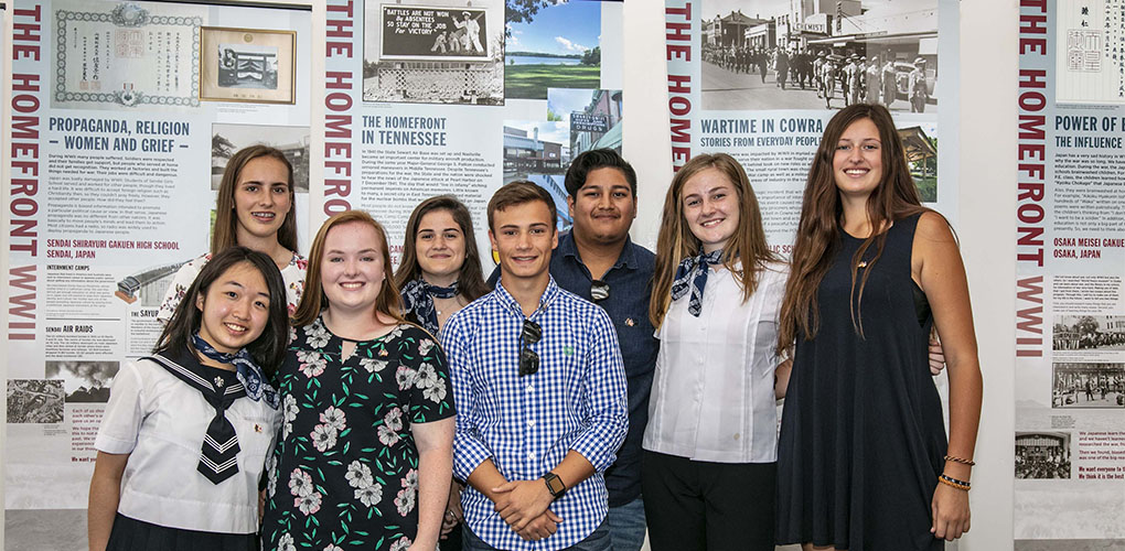Students in front of their banners, which examine the homefront and will be a travelling exhibition. 