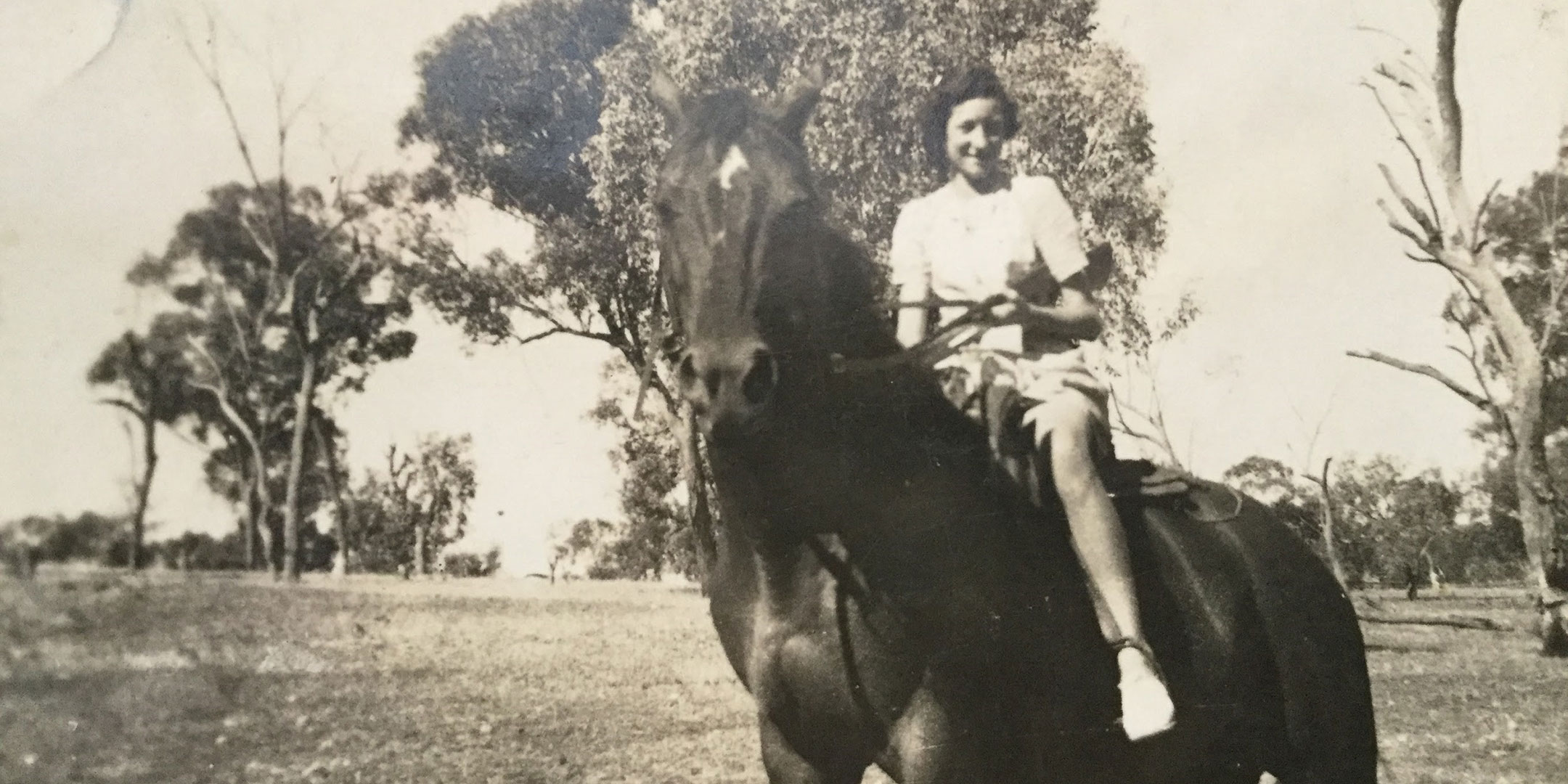 Margaret Tremble enjoying riding on the family farm as a young woman
