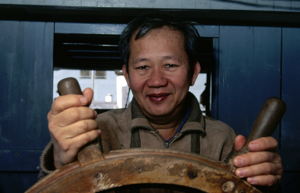 The original owner of Tu Do, Tan Thanh Lu aboard the vessel at the Maritime Museum in 1995. Photo: Jenni Carter for ANMM
