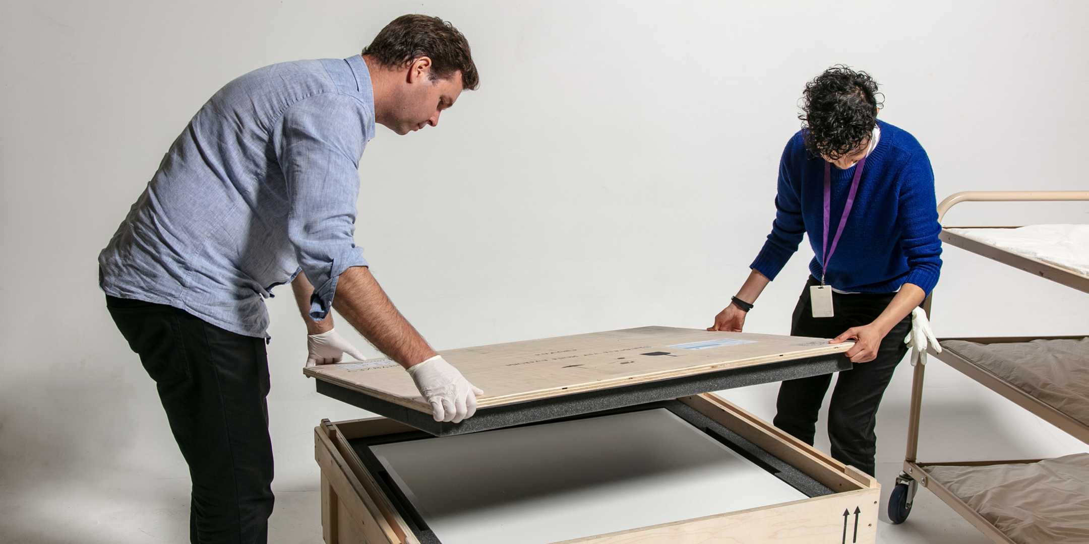 Unpacking objects for the Bligh exhibition. Registrar Anupa Shah and conservator Nick Flood carefully unpack the new acquisitions from their crate upon arrival. 