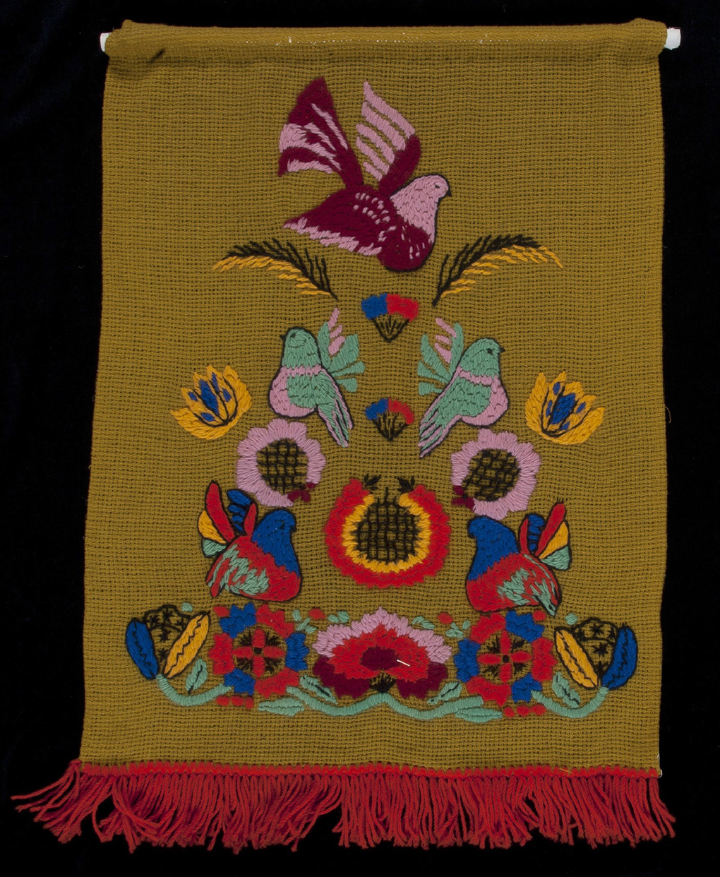 Wall hanging made by Magda Mihkelson, incorporating traditional Estonian motifs and Australian birds, 1960s. ANMM Collection 00053068.