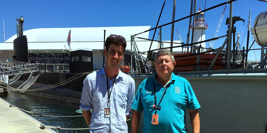 Volunteers David O'Sullivan and Tony Michaels, on the wharf. Both worked on oral histories which have been included in The Daring Ship. Image: ANMM.