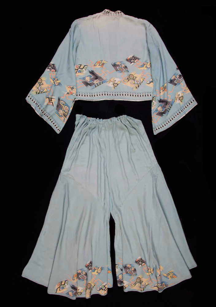 Beach pyjama set comprising a bolero jacket with flared sleeves and with trousers in pale blue silk with Art Deco and Japanese inspired silk screen print, fully lined in cream silk. ANMM Collection:  V00018343