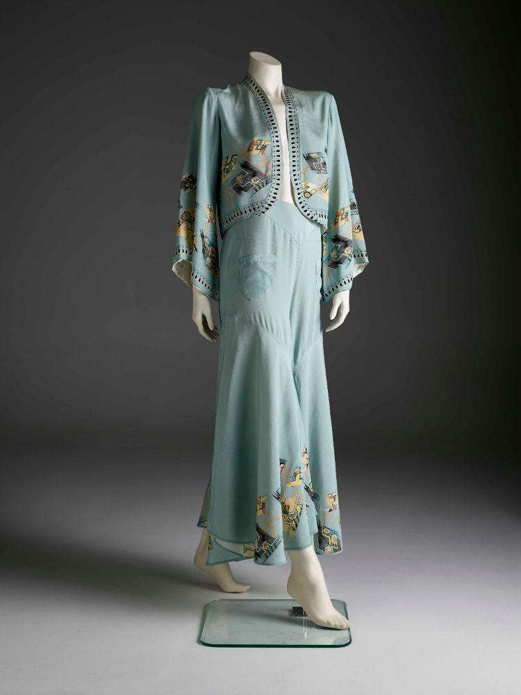 Beach pyjama set comprising a bolero jacket with flared sleeves and with trousers in pale blue silk with Art Deco and Japanese inspired silk screen print, fully lined in cream silk. ANMM Collection:  V00018343