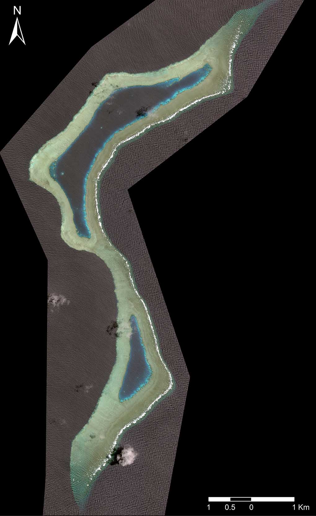 Satellite image of Boot Reef, showing the unique ‘boot’ shape for which it is named, its two narrow lagoons, and the ‘isthmus’ that separates them. Image: Google Maps.