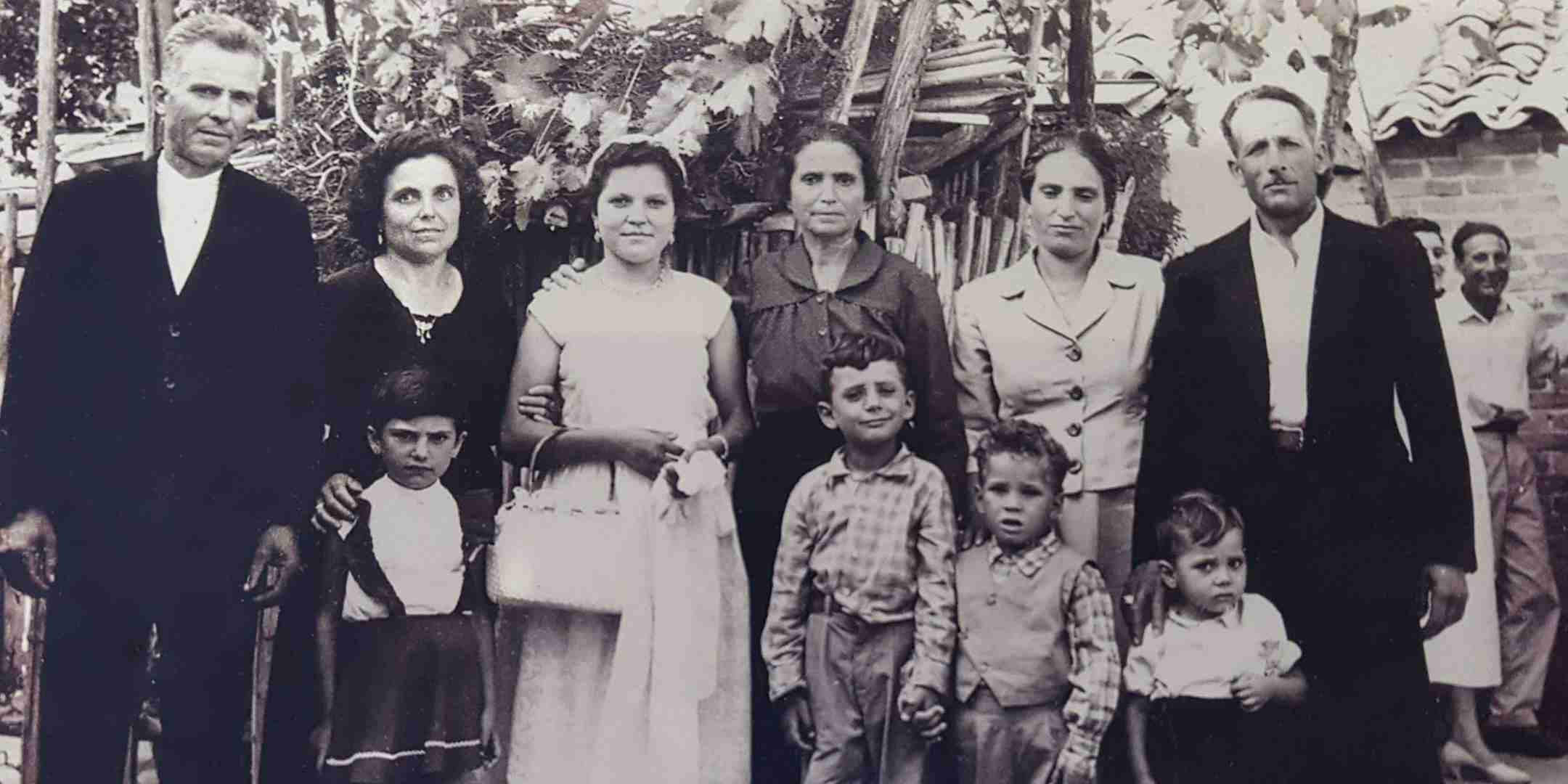 Annarosa Coluccio (third from left) with her parents (left) and mother-in-law (fourth from left) at her proxy marriage in Roccella Jonica, Calabria, Italy, 1956. Reproduced courtesy Isabella Coluccio