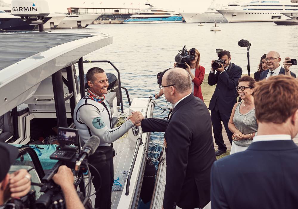Alex being greeted by H.S.H Prince Albert II of Monaco after water-skiing 11 hours from Barcelona to Monaco on day four