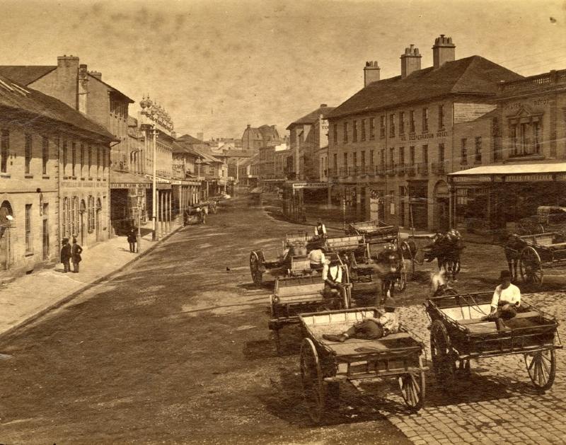 Image of George Street, Sydney in the 1880s depicting horse and carriages