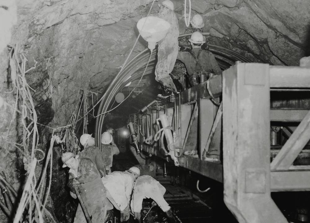 Workers place concrete reinforcement steel in the Tooma–Tumut Tunnel, part of the Snowy Mountains Hydro-Electric Scheme, 1960. Photographer Don Edwards. ANMM Collection Gift from Barbara Alysen ANMS0215[016]
