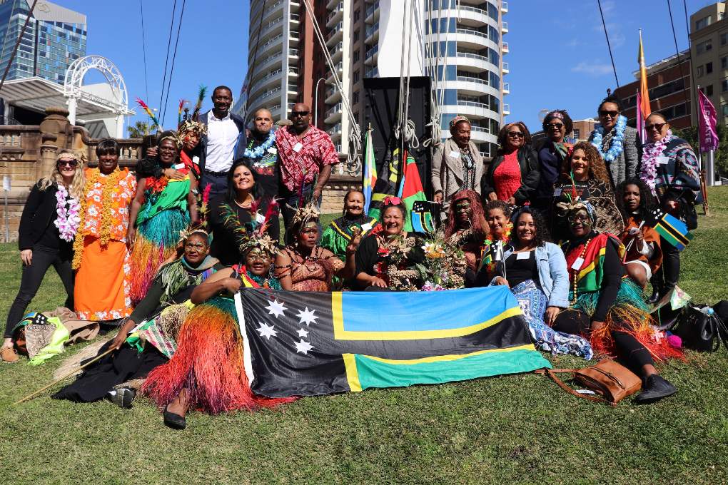 Flag raising at the Australian National Maritime Museum in 2019 by national ASSI dignitaries: custom women from Vanuatu, ASSIPJ board, New South Wales Council for Pacific Communities and the Tweed Heads community. Image Lola Forester