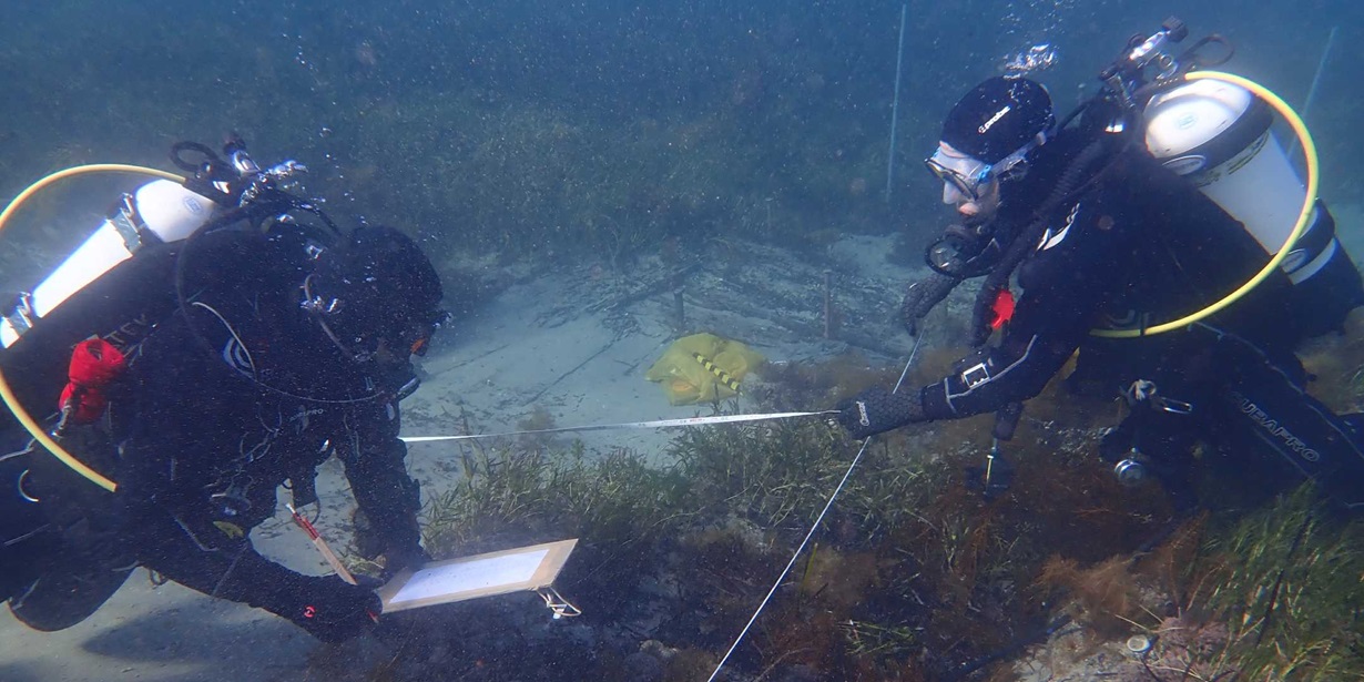 James Hunter (left) and Kieran Hosty use baseline-offset mapping to record the hull structure in South Australian's bow