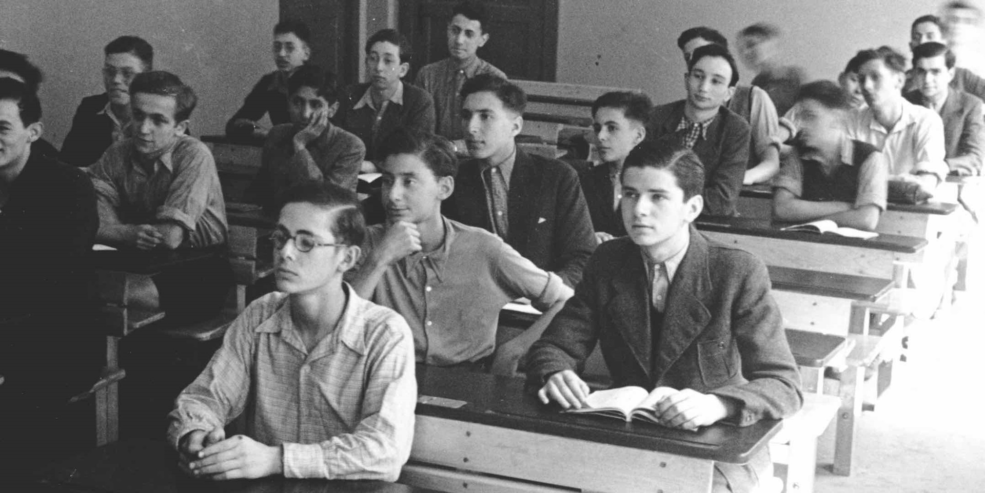 Henry Lippmann (centre, with hand on chin) during a lesson at the Jewish ORT school in Berlin, Germany, c 1939. ANMM Collection ANMS0219[007], gift from Henry Lippmann