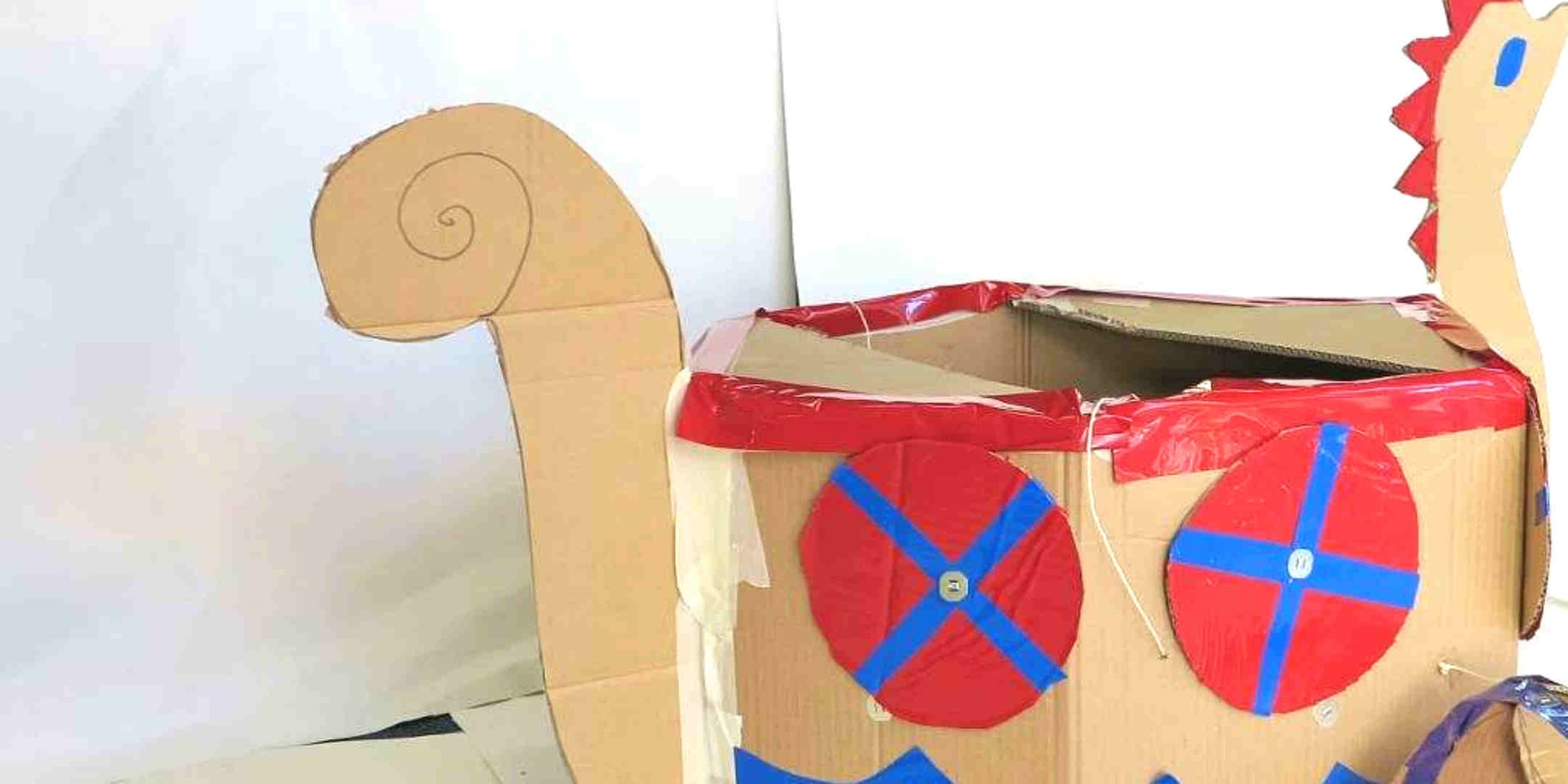 Re-use a cardboard boxes to make a fearsome viking boat, helmet and sword!