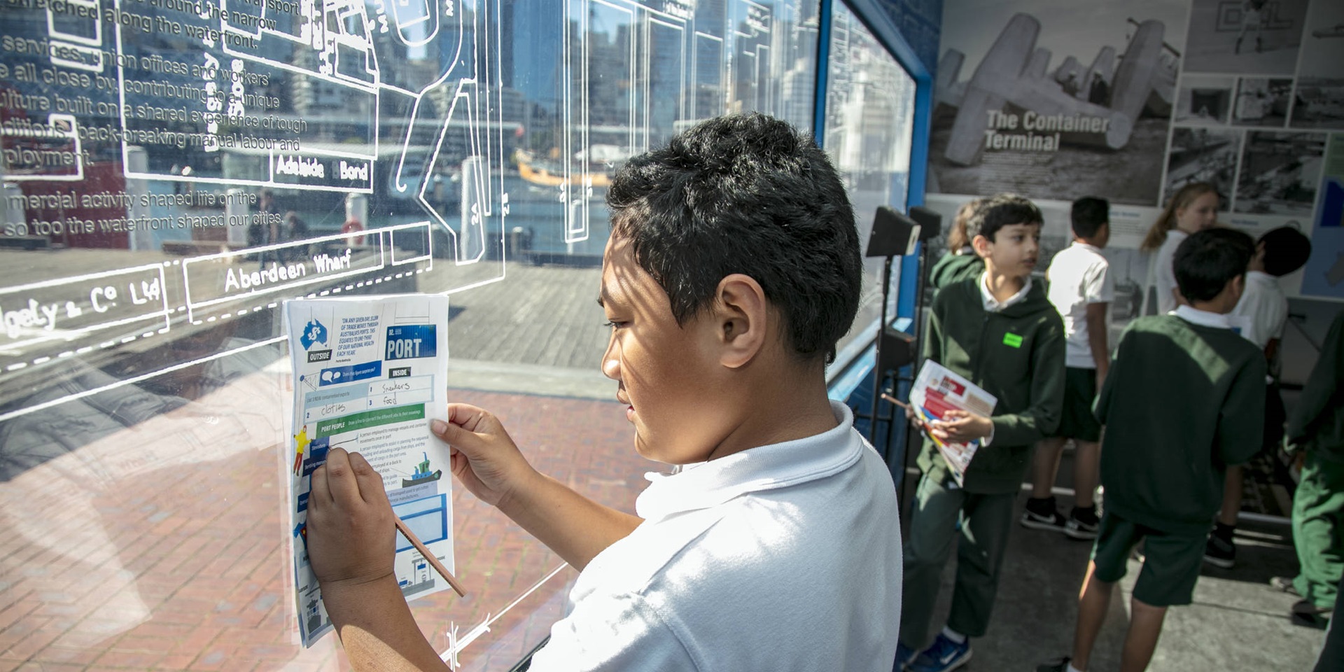 Exhibition education program. School kids visiting the 'Container' exhibition, Wharf side, ANMM, August 2018