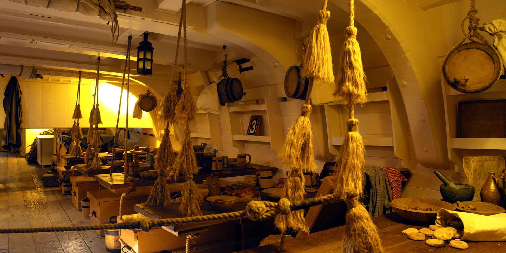 HMB Endeavour Mess Deck. The tasselled knotted ropes were used for wiping hands.