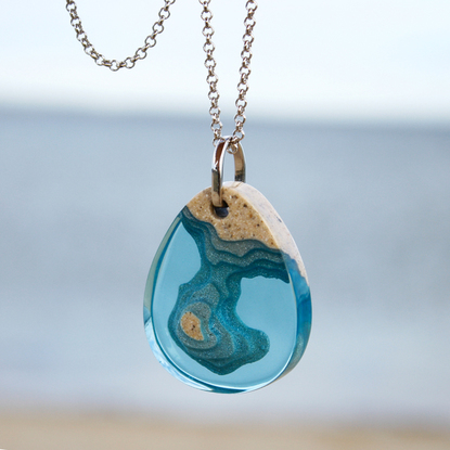 Peninsula Pendant $69.95rrp - Handmade from bonded beach sand, aqua resin and metal pigments with a high-gloss polished finish. Each purchase from our Aqua Collection will help provide one year of safe water to one person in need through BoldB's support of Water.org, an international nonprofit organisation.