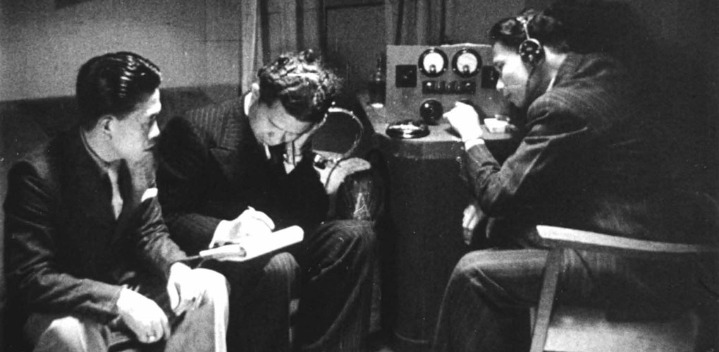 A scene from the 1946 Joris Ivens film Indonesia Calling showing Indonesian seamen listening to a short-wave radio  for news of Indonesia’s declaration of independence.  Image: National Film and Sound Archive Australia