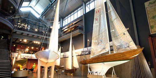 Interior views of the Wharf 7 building foyer. Pictured are various Sydney Heritage Fleet small boats.