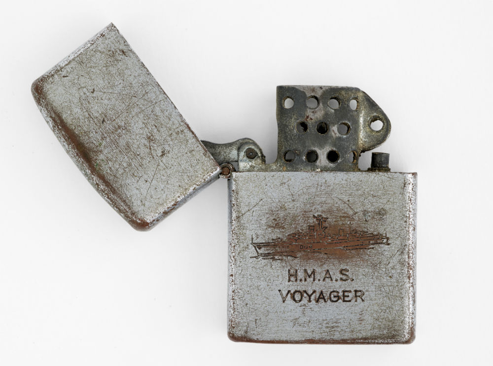Cigarette lighter. Penguin. HMAS Voyager cigarette lighter. c.1964. ANMM Collection AX000759