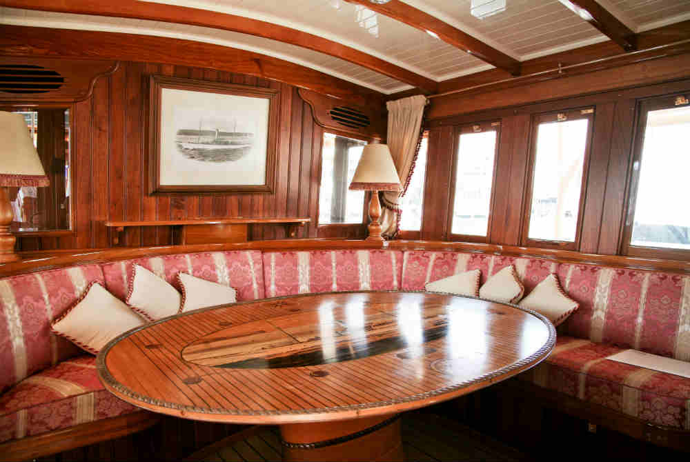 Made in 1900, Edwardian Steamer Yacht Ena features exquisite brass fixtures, polished timber and luxurious fabrics
